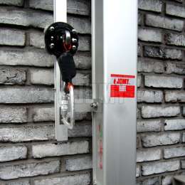 Retractable ladder with vertical lifeline Retractable ladder with added lifeline and mobile carriage.